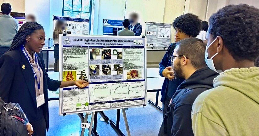 Student presenting her research poster at a conference.