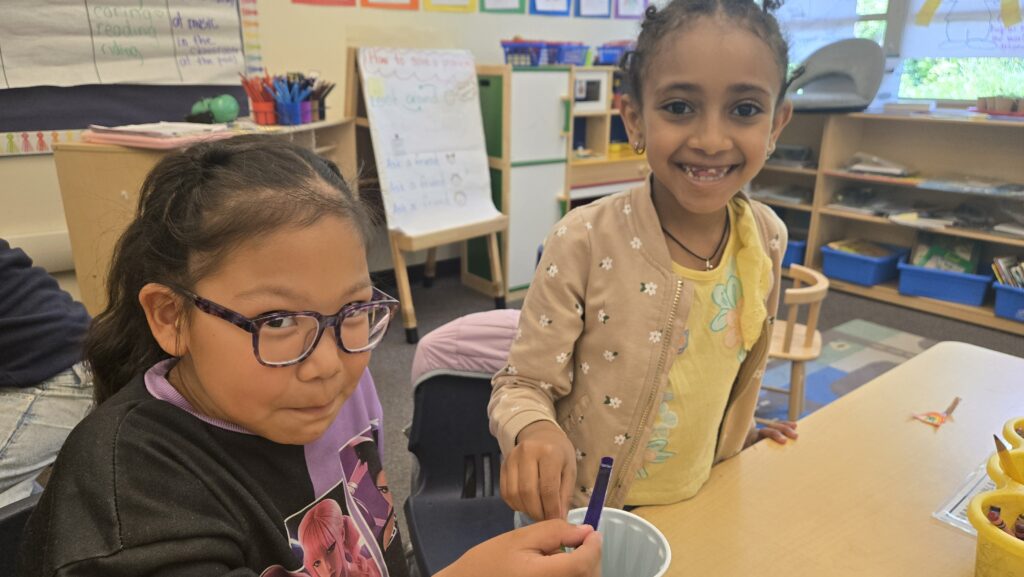 Young girls smiling at an AVELA workshop