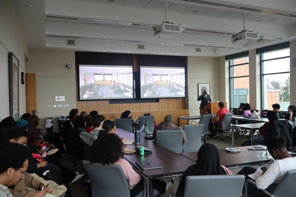 Speaker presenting in front of students at an AVELA event.