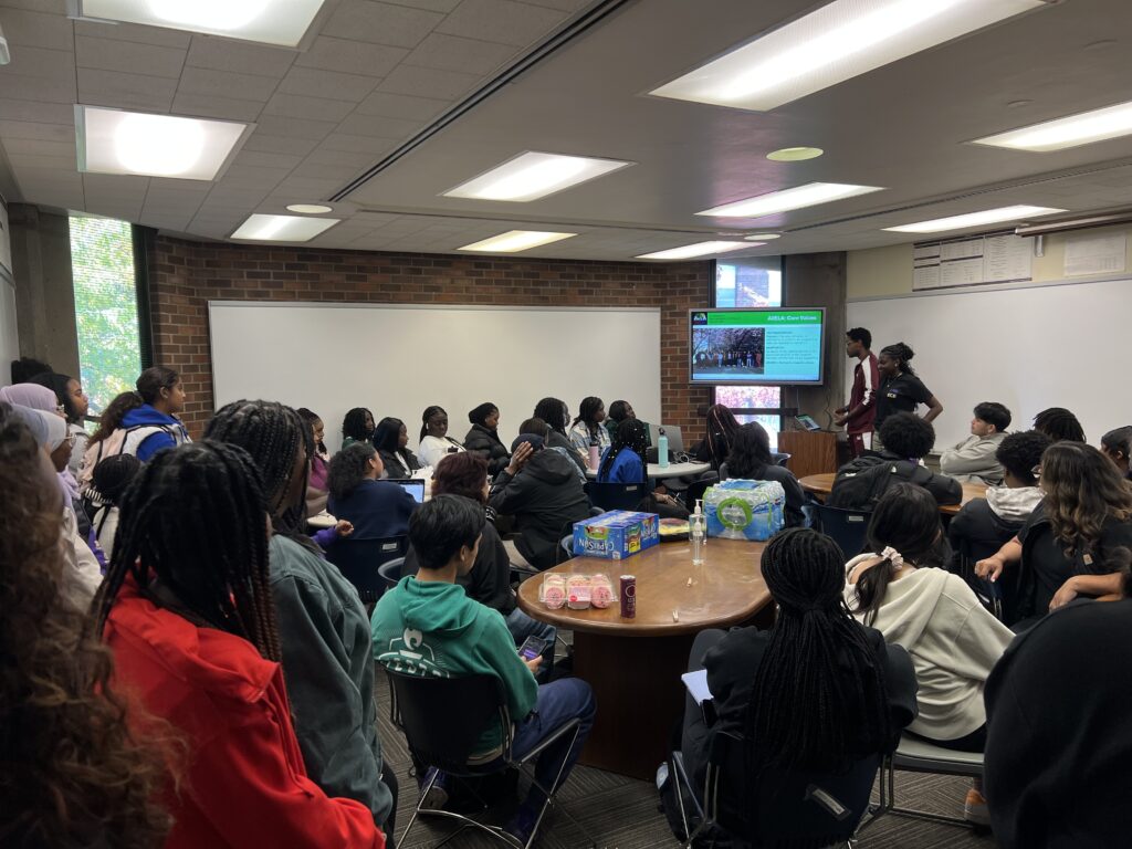 AVELA presenting to a group of students.